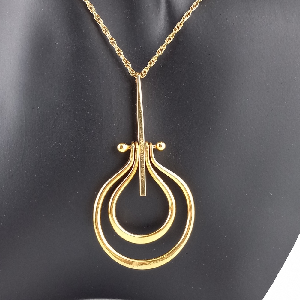 Kinetic Gold Tone MCM Necklace
